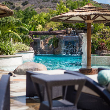 Tropical Beach Entry Pool & Spa with a Rock Slide & Grotto