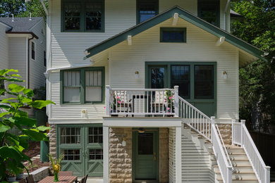Inspiration for a transitional white two-story wood exterior home remodel in DC Metro with a shingle roof and a black roof