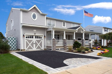 Large traditional gray two-story mixed siding house exterior idea in New York with a hip roof and a shingle roof