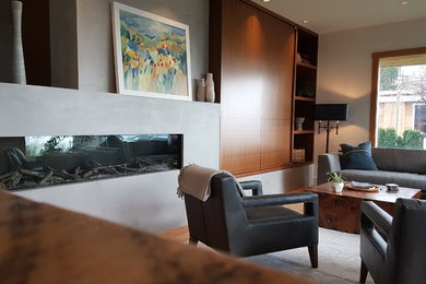 Living room - contemporary open concept light wood floor living room idea in Vancouver with white walls, a corner fireplace, a concrete fireplace and no tv