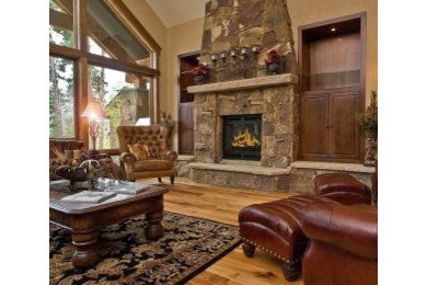 Inspiration for a large rustic formal and open concept light wood floor and brown floor living room remodel in Orange County with beige walls, a standard fireplace and a stone fireplace