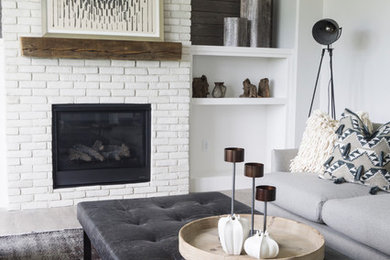 Inspiration for a craftsman medium tone wood floor and brown floor living room remodel in Cedar Rapids with white walls