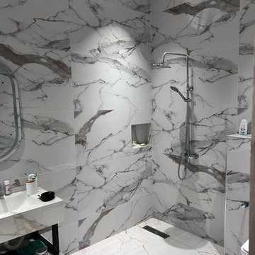Luxury Marble Bathroom – Full Slab Tile Shower Area & Suspended Vanity Zone