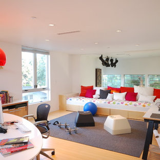 Photo of a contemporary home office in Los Angeles with bamboo floors and white walls.