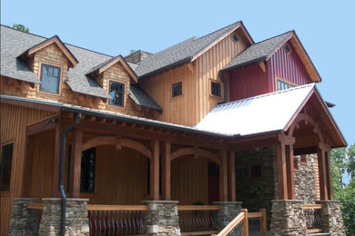 Example of a mid-sized mountain style brown two-story wood exterior home design in Other with a shingle roof