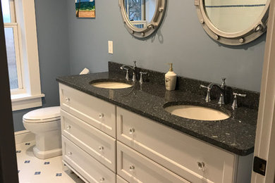 Design ideas for a small traditional master bathroom in Bridgeport with furniture-like cabinets, white cabinets, a one-piece toilet, grey walls, ceramic floors, an undermount sink, granite benchtops and white floor.