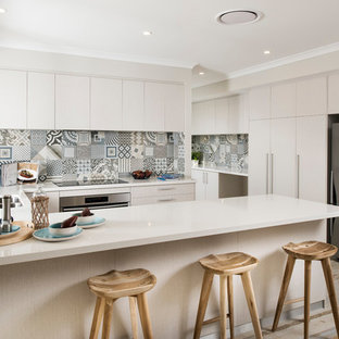 Large beach style kitchen pantry pictures - Large coastal u-shaped ceramic floor kitchen pantry photo in Perth with an undermount sink, flat-panel cabinets, light wood cabinets, quartz countertops, multicolored backsplash, ceramic backsplash, stainless steel appliances and no island