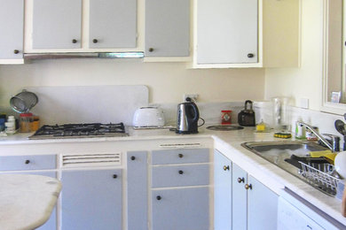 This is an example of a large beach style kitchen in Melbourne.