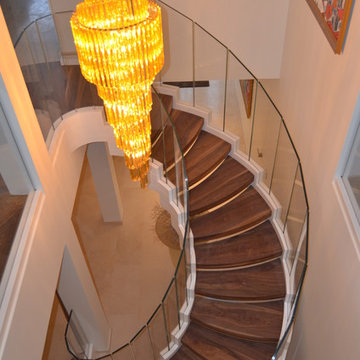 Helical stair with flared entrance