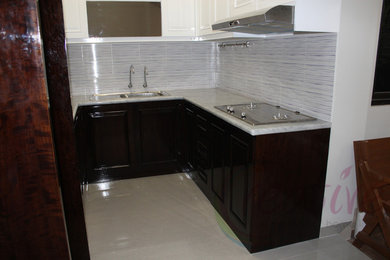Eat-in kitchen - mid-sized shabby-chic style u-shaped ceramic tile and beige floor eat-in kitchen idea in Other with an integrated sink, raised-panel cabinets, dark wood cabinets, marble countertops, gray backsplash, ceramic backsplash, stainless steel appliances and no island