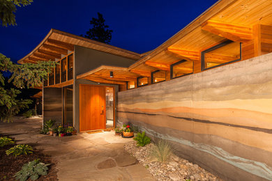 Inspiration for a contemporary entryway remodel in Vancouver with a medium wood front door