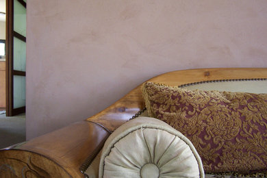 Inspiration for a contemporary bedroom remodel in San Francisco with pink walls
