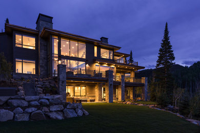Large contemporary three-story wood exterior home idea in Salt Lake City