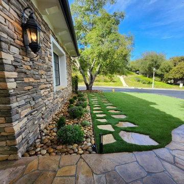 Calabasas Architectural Front Yard Revival with Artisan Stone Facade & Sculpted
