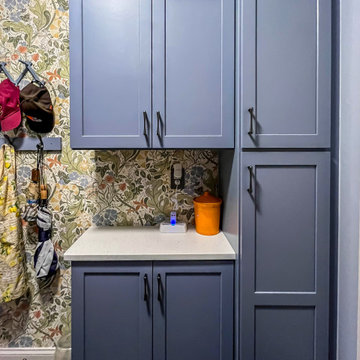 Laundry Room with Blue Painted Cabinetry and Sparkling White Quartz Countertops