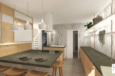 Cette image montre une cuisine encastrable et grise et blanche design avec un plan de travail en granite, une crédence verte, une crédence en céramique, carreaux de ciment au sol, îlot et un sol gris.