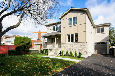 Inspiration for a mid-sized contemporary gray two-story metal exterior home remodel in Toronto