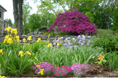 Design ideas for a huge traditional full sun backyard gravel landscaping in New York for spring.