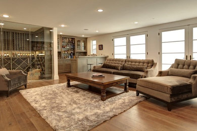 Example of a mid-sized transitional open concept light wood floor and brown floor family room design in Houston with beige walls, no fireplace and no tv