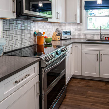 White Kitchen with White Tile Backsplash and Quartz Countertop