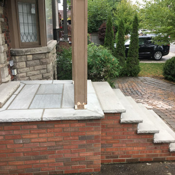 Masonry Stone Porch & Steps with Thin Veneer brick side Application.