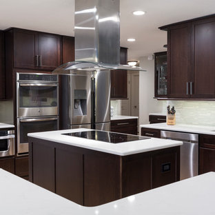 Large contemporary kitchen pantry designs - Kitchen pantry - large contemporary u-shaped light wood floor kitchen pantry idea in Tampa with a single-bowl sink, flat-panel cabinets, dark wood cabinets, quartz countertops, white backsplash, glass sheet backsplash, stainless steel appliances and two islands