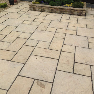 Buff Sandstone Paving and Stone Faced Raised Planter
