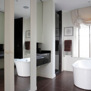 Inspiration for a mid-sized eclectic master multicolored tile and ceramic tile ceramic floor and purple floor bathroom remodel in London with light wood cabinets, a one-piece toilet, white walls, a drop-in sink, onyx countertops and a hinged shower door