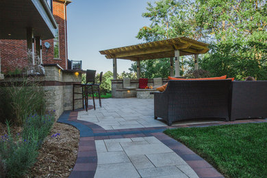 This is an example of a mid-sized traditional patio in Toronto.