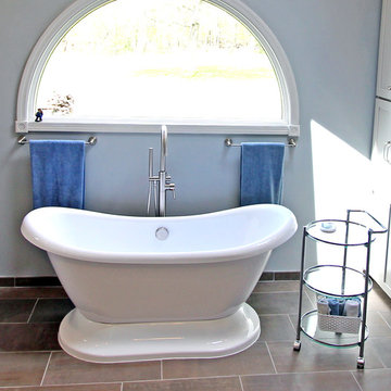 Gray Vanity with Freestanding Tub and Tiled Walkin Shower