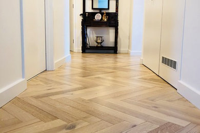 Inspiration for a hallway in Perth with light hardwood floors.