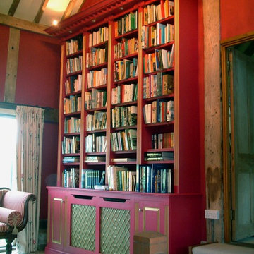 Gilded and painted library over several rooms in a converted 11th century barn