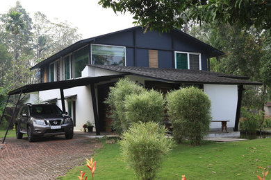 Example of an island style exterior home design in Bengaluru