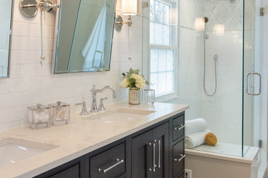This is an example of a transitional master bathroom in Chicago with beaded inset cabinets, dark wood cabinets, white tile, subway tile, porcelain floors, an undermount sink, engineered quartz benchtops and white benchtops.
