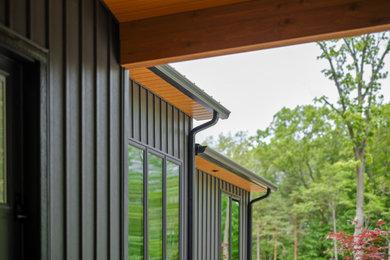 Inspiration for a gray metal and board and batten house exterior remodel in Grand Rapids