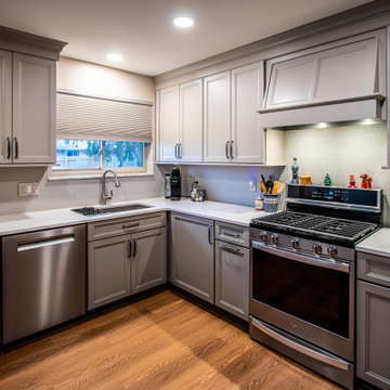 Two-Tone Neutral Kitchen with Quartz Countertop and Soho Picket Backsplash