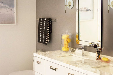 Large minimalist master marble floor bathroom photo in San Francisco with flat-panel cabinets, white cabinets, a two-piece toilet, gray walls, an undermount sink and granite countertops