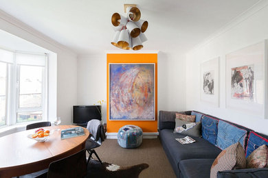 Example of a mid-sized mid-century modern enclosed carpeted and brown floor living room design in London with white walls, no fireplace and a tv stand