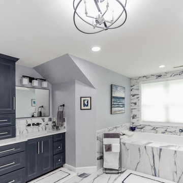 Bathroom remodeling in Columbia, MD with double vanity & marble bathtub