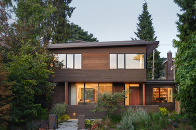 Contemporary brown two-story wood house exterior idea in Seattle with a shed roof
