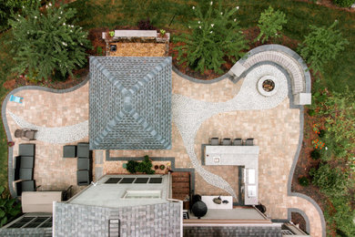 Patio kitchen - large traditional backyard concrete paver patio kitchen idea in Richmond with a pergola