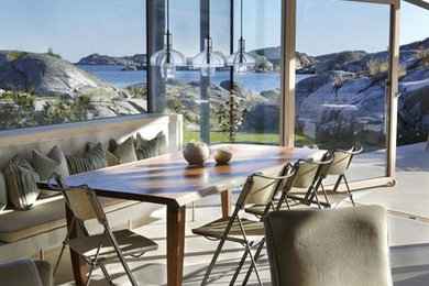 Minimalist concrete floor dining room photo