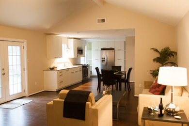 Living room - mid-sized traditional open concept dark wood floor living room idea in Houston with beige walls