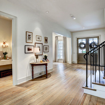 Briargrove entryway with view of front door & powder room