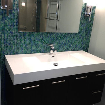Wall-mount vanity with integrated sink and wall sconces