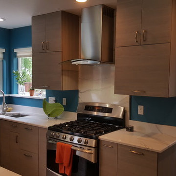 This is a two tone updated kitchen with efficient use of space & feature points
