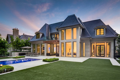 Inspiration for a large transitional beige two-story stone exterior home remodel in Toronto