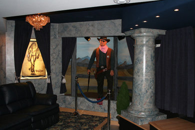Inspiration for a mid-sized contemporary home theater remodel in Milwaukee with multicolored walls and a media wall