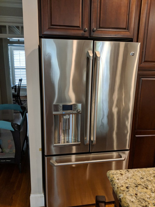 Refrigerator next to wall hinges?