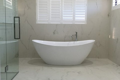 Photo of a bathroom in Perth with a freestanding tub.